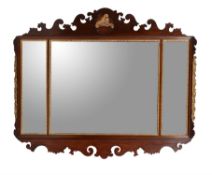 A mahogany and parcel gilt fretwork wall mirror in George II style