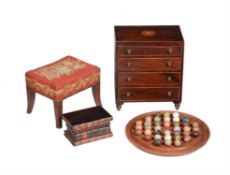 A George III mahogany and inlaid miniature chest of drawers