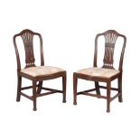 A pair of George III mahogany side chairs