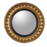 A Regency giltwood convex wall mirror