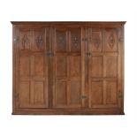 An oak panelled wardrobe in late 17th century style