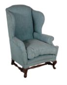 A wing armchair in early 18th century style