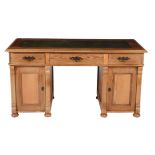 A pine pedestal desk