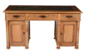 A pine pedestal desk