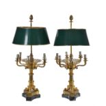A pair of Restauration gilt metal and verde antico mounted six light candelabra