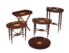 A group of occasional tables and trays