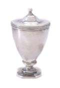 A George III silver urn shaped nutmeg grater by William Parker
