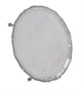 A silver shaped circular salver by Thomas Bradbury & Sons