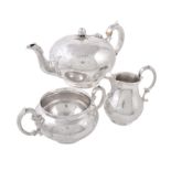 Y A matched Victorian silver circular three piece tea service by Edward & John Barnard
