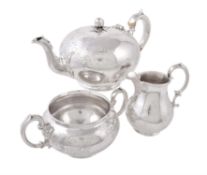 Y A matched Victorian silver circular three piece tea service by Edward & John Barnard