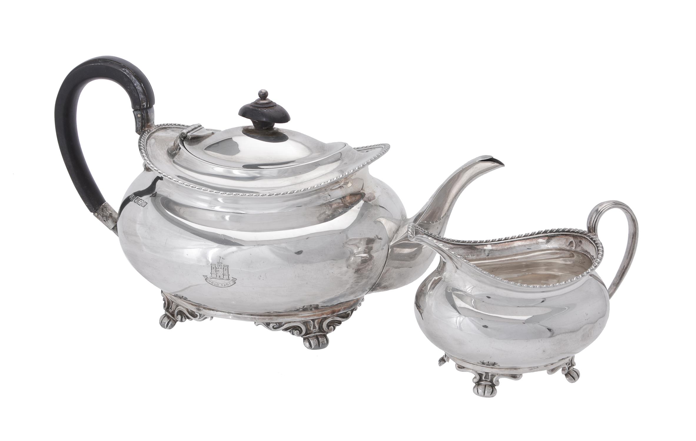 A silver oblong baluster tea pot and cream jug by Atkin Brothers