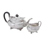 A silver oblong baluster tea pot and cream jug by Atkin Brothers