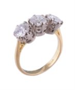 An 18 carat gold diamond three stone ring