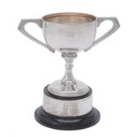 A silver twin handled pedestal trophy cup by A. G. Sheppard Ltd.