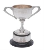A silver twin handled pedestal trophy cup by A. G. Sheppard Ltd.