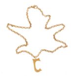 An 18 carts gold initial pendant by Cassandra Goad