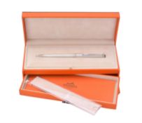 Hermès, a silver coloured ball point pen