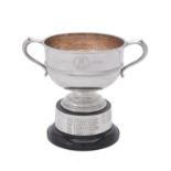 A silver twin handled pedestal cup