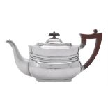 A late Victorian silver oblong baluster tea pot by Edward Barnard & Sons Ltd.