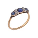 An early 20th century sapphire and diamond seven stone ring