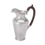 A late Victorian silver milk jug by Holland, Aldwinckle & Slater