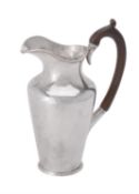 A late Victorian silver milk jug by Holland, Aldwinckle & Slater