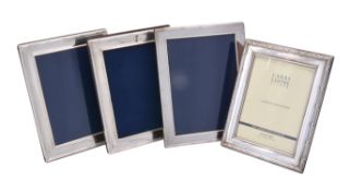 A pair of silver mounted photo frames by Victoria Silverware Ltd.