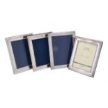 A pair of silver mounted photo frames by Victoria Silverware Ltd.