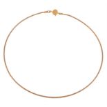 A gold collar necklace by Cassandra Goad