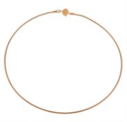 A gold collar necklace by Cassandra Goad