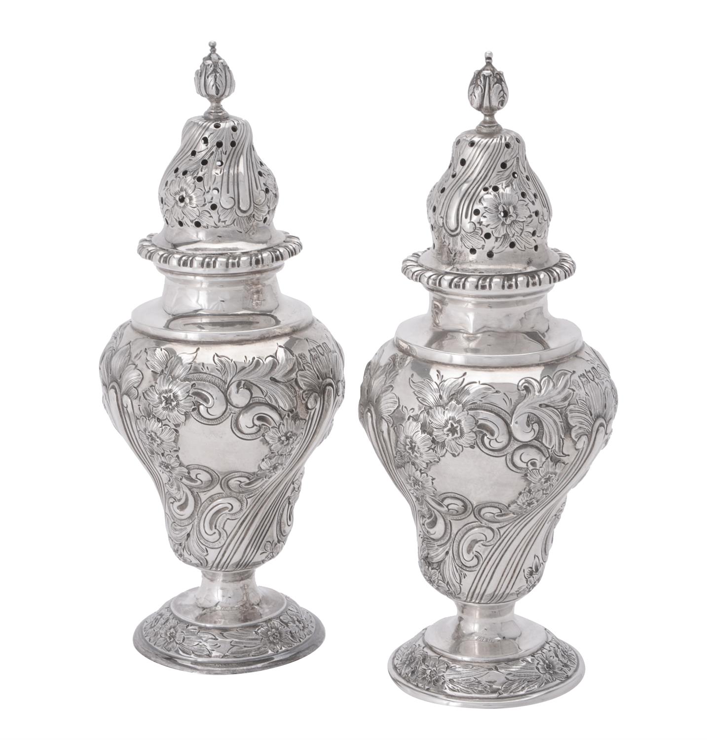 A pair of Edwardian silver sugar casters by C. S. Harris & Sons Ltd.