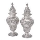 A pair of Edwardian silver sugar casters by C. S. Harris & Sons Ltd.