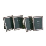 A set of four silver mounted photo frames by Harrod's Ltd.