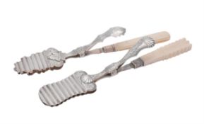 Y A pair of Dutch silver and ivory handled serving tongs