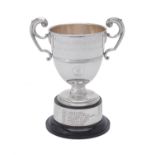 A silver twin handled pedestal trophy cup by Robert Pringle & Sons