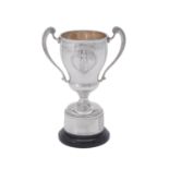 A silver twin handled baluster vase shaped trophy cup by Bravingtons Ltd.