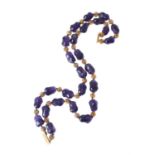 An amethyst and gold coloured bead necklace