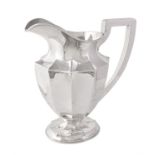 An American silver panelled oval footed water pitcher or jug by The Sweetser Co.