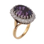 An 18 carat gold amethyst and diamond cluster ring
