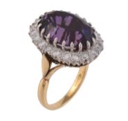 An 18 carat gold amethyst and diamond cluster ring