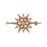 An Edwardian half pearl and diamond star brooch