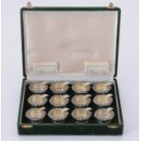 A cased set of twelve Italian silver coloured circular ashtray/place holders