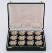 A cased set of twelve Italian silver coloured circular ashtray/place holders