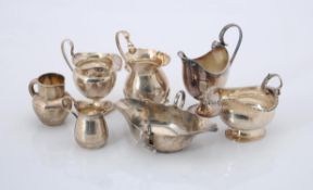 A collection of silver cream jugs