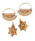 A pair of gold coloured earrings