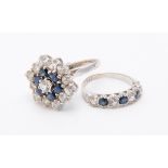 A sapphire and white stone target cluster ring