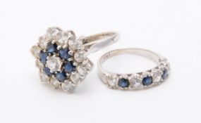 A sapphire and white stone target cluster ring