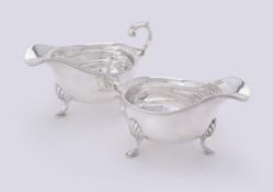 A pair of silver oval sauce boats by Harrison Brothers & Howson