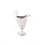 A George III silver helmet shaped cream jug