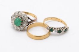 A 1970s 18 carta gold diamonds and emerald cluster ring